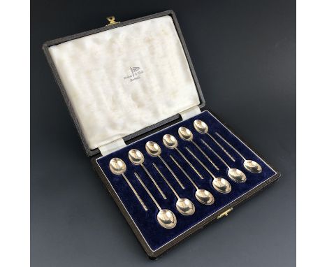 A cased set of twelve Elizabeth II silver arrow style coffee spoons, with slender stems terminating in a chevron design, Walk