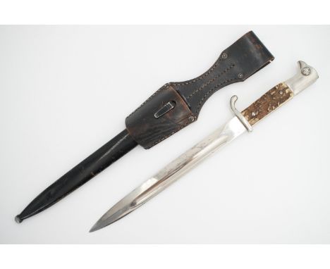 A German Third Reich KS98 dress bayonet by Alcoso, a variant having stag horn grip scales, with frog