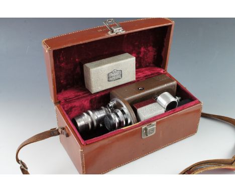 A Bell &amp; Howell Auto Master 16mm cine camera cased with Kodak Anastigmat F-2.7 633mm, Wollensak 17mm F 2.7 Velostigmat, B