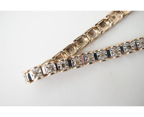 A vintage 9ct gold and diamond 'tennis' bracelet, each link having open D-shaped supports flanking a floating white-metal pla