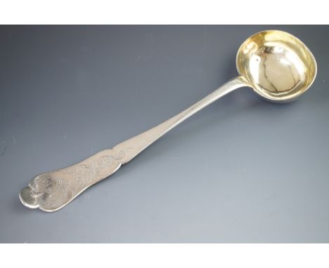A late 19th Century Italian 800 standard white metal ladle, having a cusped handle and engraved decoration incorporating the 