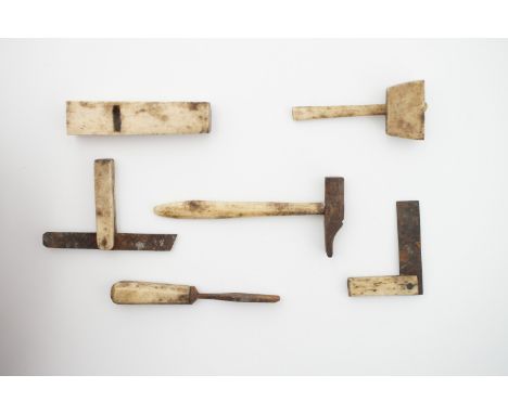 A quantity of 19th century miniature bone hand tools, including a chisel, woodworking plane and mallet etc