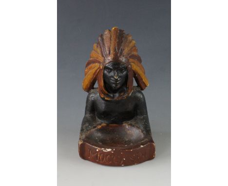 A vintage "Moccasin" ceramic advertising ashtray, modelled as a Native American, 16 cm