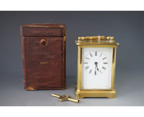 A late 19th / early 20th Century carriage clock in original transit case, 10.5 cm excluding handle