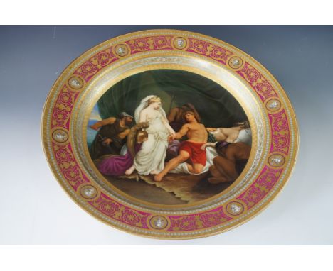 A Vienna porcelain charger, hand enamelled with a Classical scene depicting "Thetis, consolant Achille qui pleure la mort de 