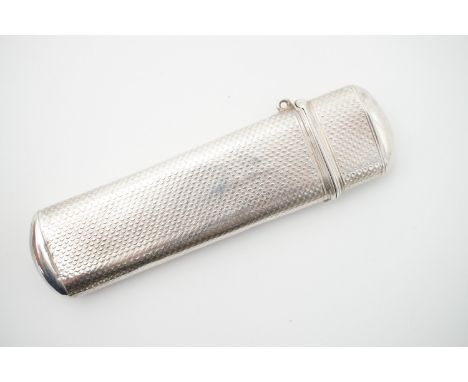 A Victorian silver lancet case, with hinged cover and engine-turned decoration surrounding a shield-shaped cartouche engraved