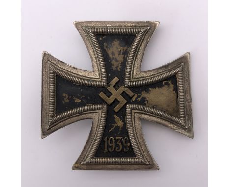 A 1939 Iron Cross first class, a brass-cored example, the pin stamped "75"