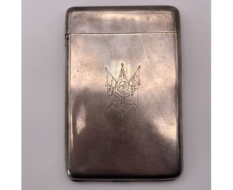 A late Victorian white metal (tested as silver) combination cigarette and match case, bearing an engraved depiction of regime
