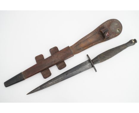 A Second World War Fairbairn Sykes / FS fighting knife, a second pattern example, the cross guard bearing a broad arrow and n