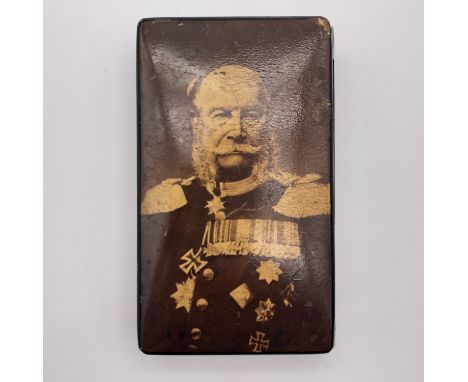 An Imperial German lacquer match / Vesta case, the hinged lid bearing a photographic portrait of Kaiser Wilhelm I (1797-1888)