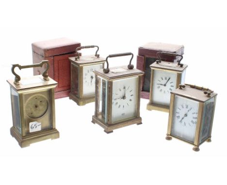 Five various carriage clock timepieces, two with outer Morocco leather travelling cases, all in need of some restoration and 
