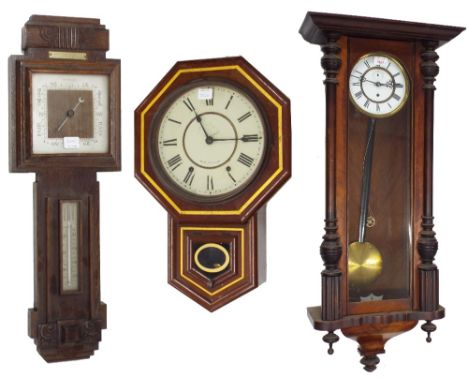 Walnut single weight Vienna regulator wall clock, the 6.5" white dial within a pillared glazed case, 39.5" high (pendulum and