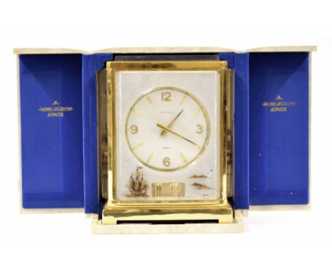 Jaeger-LeCoultre Marina Model Atmos clock, the 4.25" recessed dial within a plexi glazed case gilded with galleons to the fro