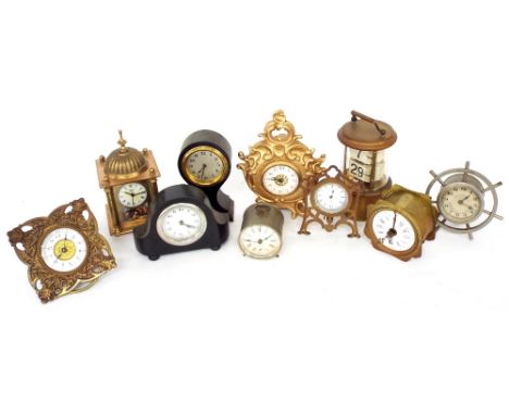 Small cylindrical glazed brass ticket clock, surmounted by a carrying handle, 6" high; also nine various small boudoir timepi