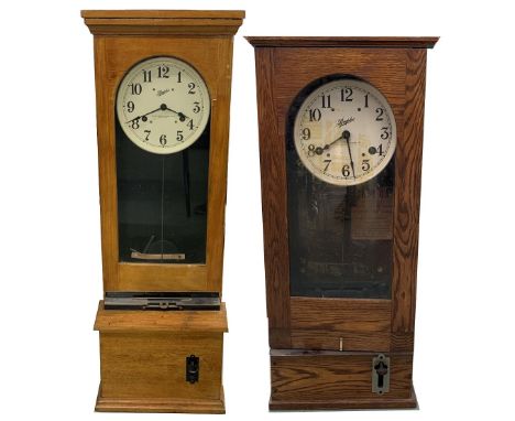 Simplex clocking-in clock, signed on the 10" white dial, within a light oak glazed case, 46" high (pendulum and key); also a 