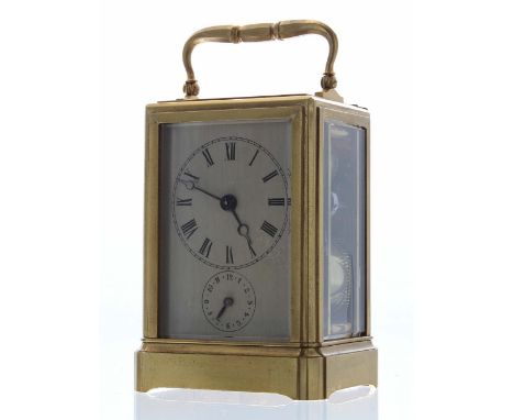 Good alarm carriage clock striking on a bell, the movement back plate stamped 30M and enclosed by a vertical sliding door wit