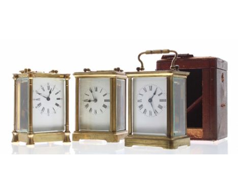 Carriage clock timepiece within a corniche brass case, 5.5" high (key); also with an outer Morocco leather travelling case an