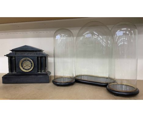 Garniture of glass domes and bases, the central oval dome 20" high, 13" wide, 7" deep, pair of circular domes 17.5" high, 6.2