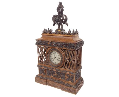 Unusual Black Forrest type oak Gothic two train mantel clock,  with French movement stamped Laine á Paris, with outside count