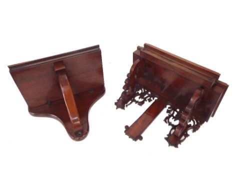 Attractive mahogany breakfront clock bracket, the stepped front over shaped curving brackets and pierced scrolling foliage, 1
