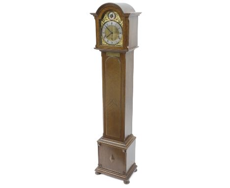 Oak three train grandmother clock, the 8.5" brass arched dial with silvered chapter ring enclosing a matted centre, with slow