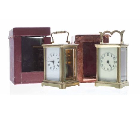 Two carriage clock timepieces in corniche brass cases, both 5.75" high and with outer Morocco leather travelling cases (2)