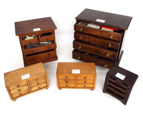 Five miniature chests of drawers containing various small clock parts and tools, tallest 9.25" x 9.75" wide (5)