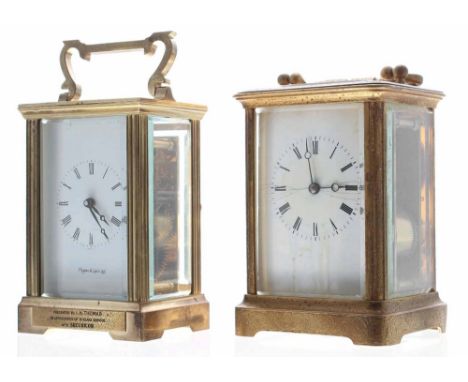 French carriage clock striking on a bell, within a foliate engraved corniche brass case, 6.5" high (damage to the dial and la