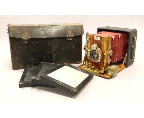 The Sanderson Hand Camera with Bausch &amp; Lomb f8 7 1/2" lens and Unicum shutter; mahogany body with brass fitting, in carr