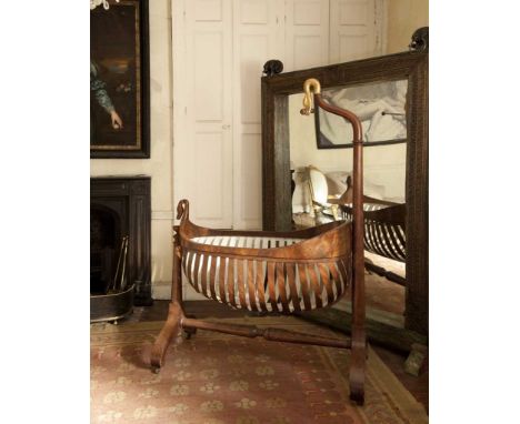 LOUIS PHILIPPE MAHOGANY CRADLE, swan's head drape support, over navette-shaped cradle with slatted sides, raised on a curved 