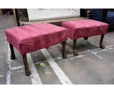 SIMILAR PAIR OF GEORGIAN STYLE DRESSING STOOLS, with lion's paw feet, stuffover seats, overcovered with faded, banded satin u