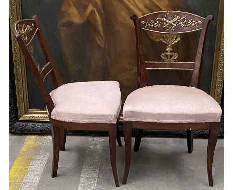 PAIR EMPIRE STYLE PARCEL GILT MAHOGANY SIDE CHAIRS, 19th C., backs applied with moulded foliage and trophies, serpentine stuf