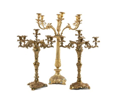 THREE GILT METAL CANDELABRA, comprising pair of five-light candelabra, 61cms (h), and single seven-light candelabrum, 77cms (