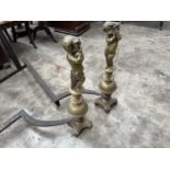 PAIR OF 19TH C. BRASS FIGURAL CHENETS, cast as putti holding cornucopia on sphere bases, 67cms (h)