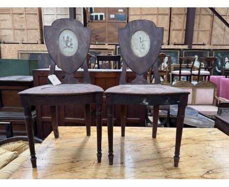 PAIR OF 19TH C. MAHOGANY HALL CHAIRS, shield back with inset cream painted panels depicting mermaid with mirror and comb, tur