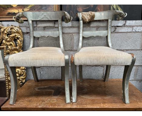 PAIR OF INDIAN DINING CHAIRS, with white metal foil veneer and ram’s head finials, stuffover seats (2)Provenance: The Corneli