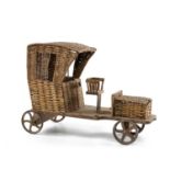 ANTIQUE WICKER TOY AUTOMOBILE, with rear cast iron wheels, 52cms (l) Comments: replaced front axle