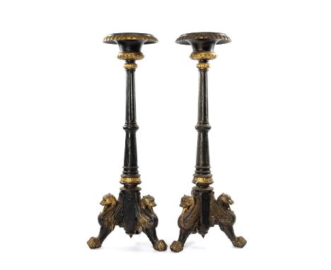 PAIR OF PARCEL-GILT, EBONISED & CAST IRON TORCHÈRES, gadrooned rims to fluted columns and leopard monopodia tripod base, 122c