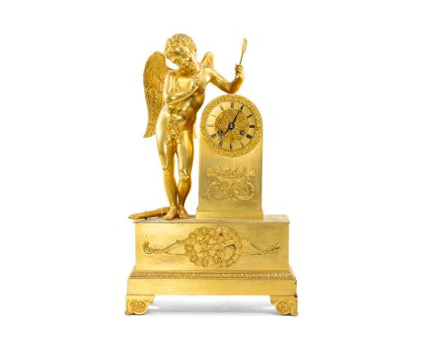 EMPIRE STYLE GILT BRONZE FIGURAL MANTEL CLOCK, with cupid surmount holding arrow, on plinth base applied with trophies, gilt 