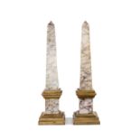 PAIR GRAND TOUR STYLE VARIEGATED MARBLE OBELISKS, stepped gated bases and plinths, measurements to