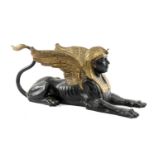 PARCEL GILT BRONZE EGYPTIAN SPHYNX, recumbent with raised wings, 102cms (l) Provenance: The Cornelia