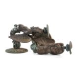 TEN CAST & PAINTED METAL FIGURAL WALL BRACKETS, modelled as winged putti, holding urns to their