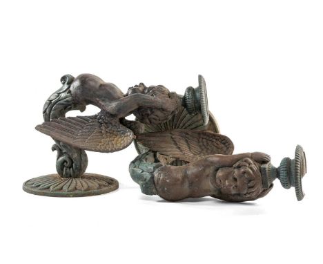 TEN CAST & PAINTED METAL FIGURAL WALL BRACKETS, modelled as winged putti, holding urns to their heads, 24cms (h) (10)Comments