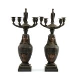 PAIR OF PATINATED BRONZE EGYPTIAN REVIVAL FIVE-LIGHT CANDELABRA, with stork finials above canopic