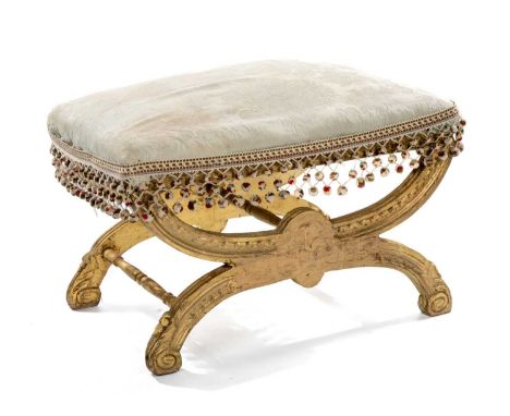VICTORIAN GILT X-FRAME STOOL, stuffover seat on bowed supports with scrolled feet, 45 (h) x 61 (w) x 41cms (d)Comments: front