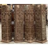 FOUR CARVED ARCHITECTURAL HARDWOOD ELEMENTS, possibly from lintel or doorway, each 88cms (h) (4)