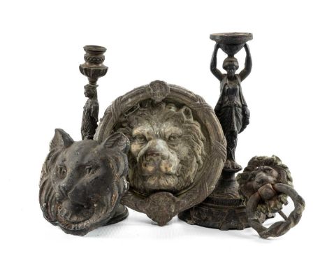 ASSORTED DECORATIVE METALWARE, including large lion mask door knocker, pair of figural chenets, two candlesticks, etc. (8)Pro