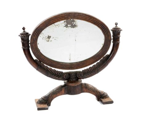 GEORGE IV MAHOGANY TOILET MIRROR, oval plate with reeded frame on acanthus carved bowed support with urn finials, anthemion c