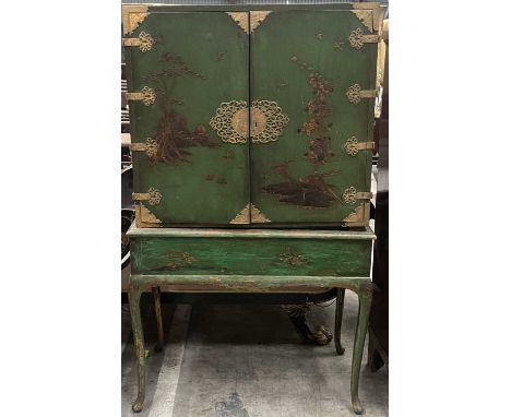 17TH C. STYLE GREEN & GILT JAPANNED CABINET ON STAND, pierced gilt brass mounts, raised chinoiserie decoration to cabinet doo