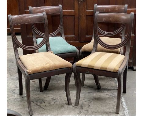 SET OF FOUR REGENCY MAHOGANY DINING CHAIRS, bowed and draped backs, drop-in seats, sabre legs, 88cms (h) (4)Comments: old woo